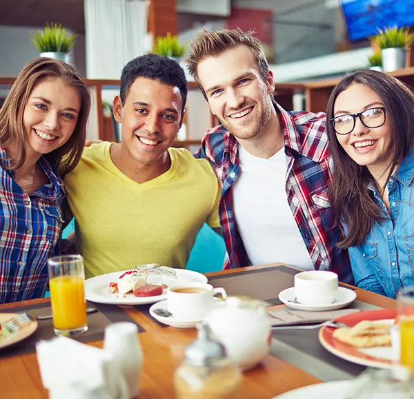 College students eating together at a cafe