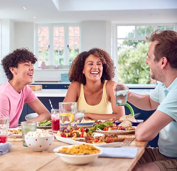 Family sharing a meal together at home